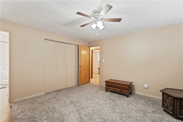 unfurnished bedroom with light carpet, a ceiling fan, baseboards, and a closet