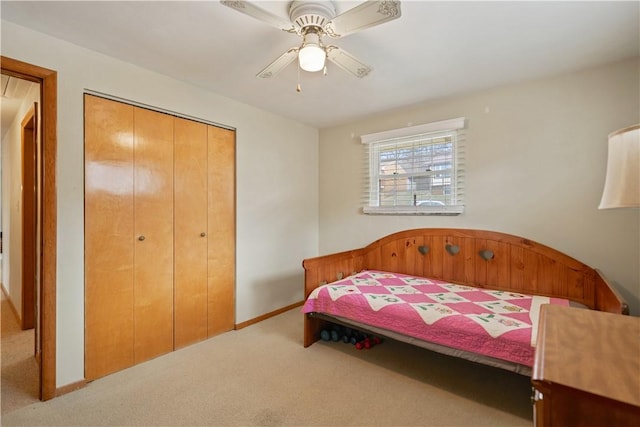 bedroom featuring a closet, carpet flooring, ceiling fan, and baseboards