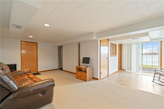 living area featuring light colored carpet, visible vents, baseboards, and recessed lighting