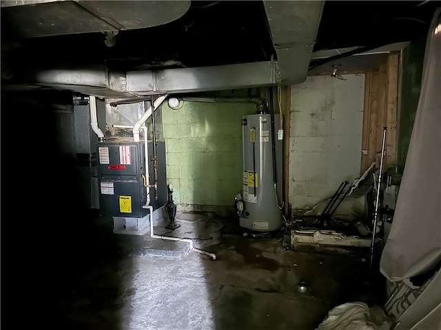 utility room featuring water heater and heating unit