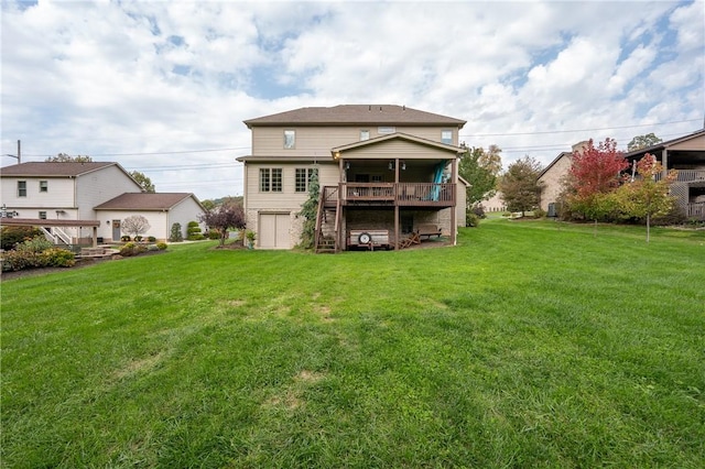 back of property featuring a yard, stairway, and a wooden deck