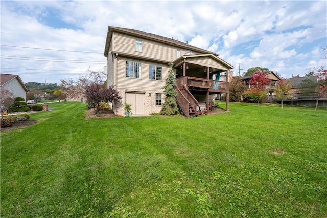 rear view of property featuring stairway, a deck, and a yard