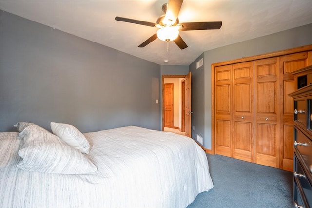 bedroom featuring visible vents, baseboards, a ceiling fan, a closet, and carpet