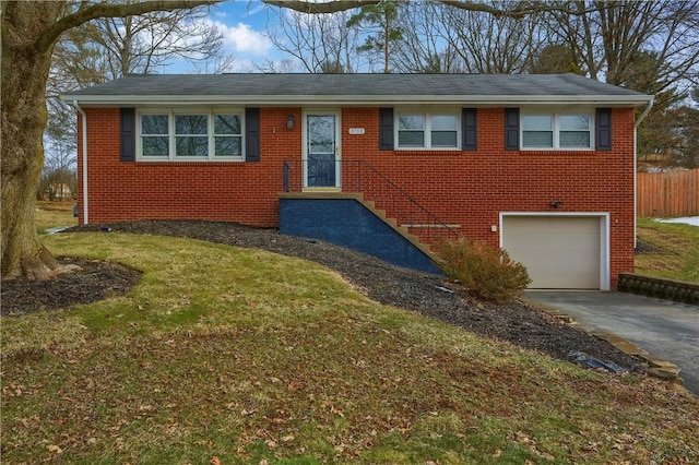 ranch-style home with a garage, driveway, and brick siding