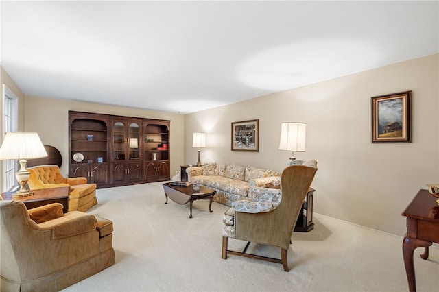 living area with light colored carpet