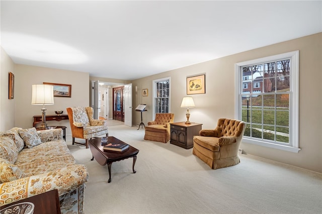 living area featuring light colored carpet