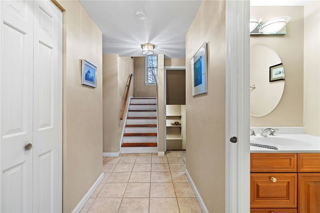 interior space with tile patterned flooring and baseboards