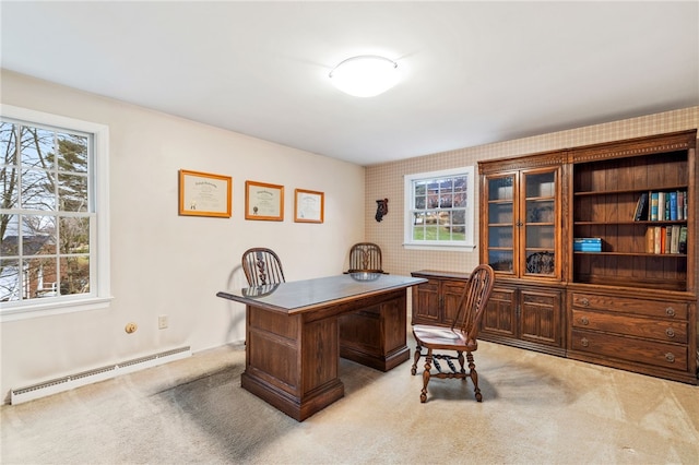 office space featuring a baseboard radiator and light colored carpet