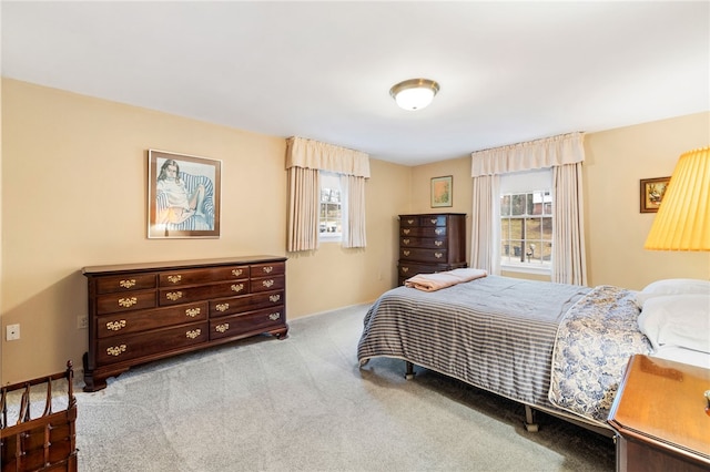 bedroom featuring light carpet