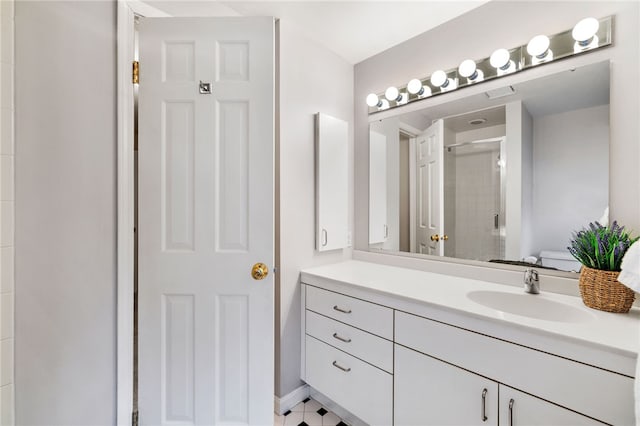 full bathroom with a stall shower and vanity