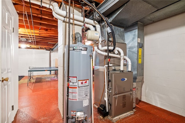 utility room with gas water heater