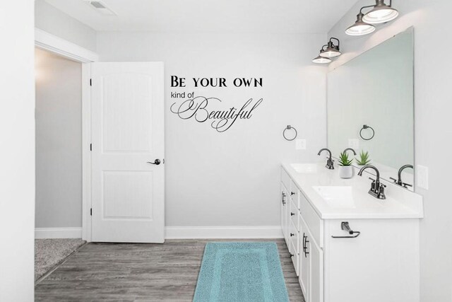 115 White Fox Ct Unit 33, North Sewickley Twp, PA 16117 - full bath featuring double vanity, baseboards, and wood finished floors