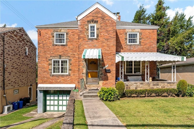 view of front of home with an attached garage, brick siding, a front lawn, ac unit, and a chimney