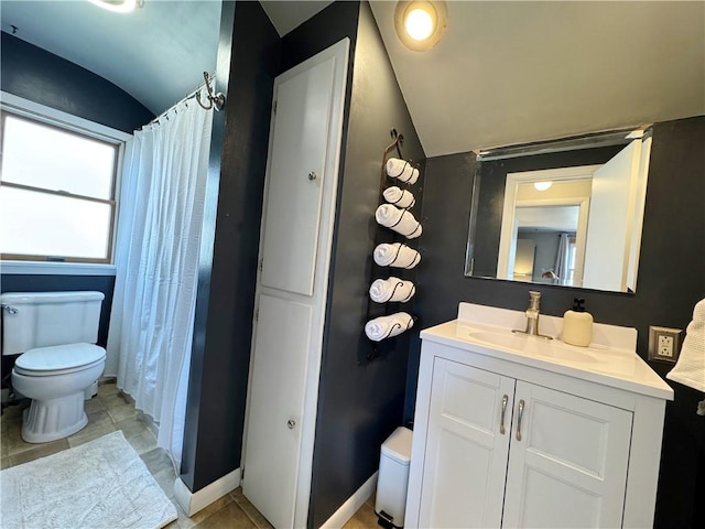 full bathroom with toilet, vaulted ceiling, and vanity