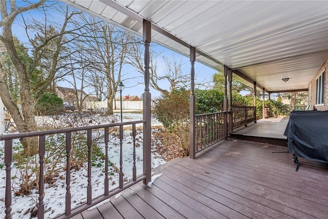 snow covered deck featuring grilling area