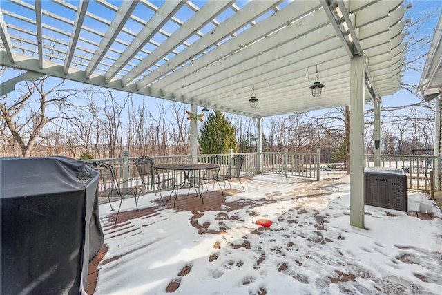 snow covered deck featuring area for grilling