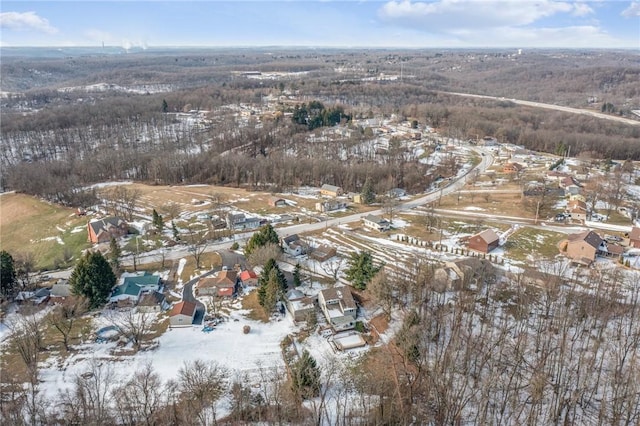 snowy aerial view featuring a residential view