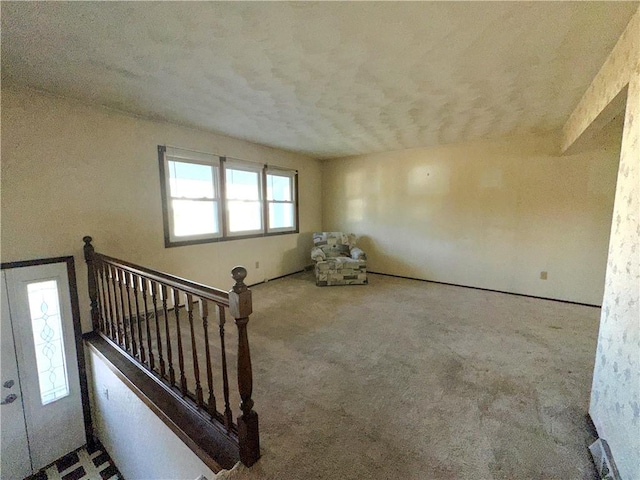 unfurnished room with carpet floors