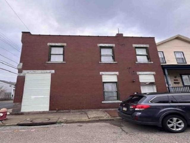 view of front of house with brick siding