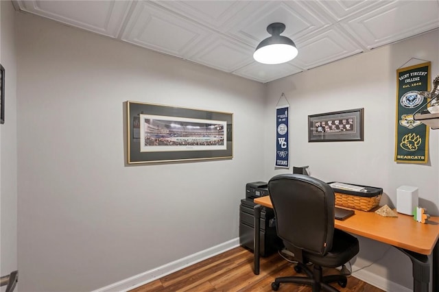 office area with wood finished floors and baseboards