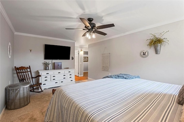 bedroom with ceiling fan, baseboards, light colored carpet, and crown molding