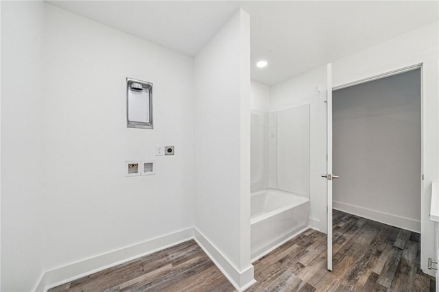 bathroom featuring shower / bath combination, baseboards, wood finished floors, and recessed lighting