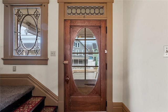 doorway to outside featuring stairway