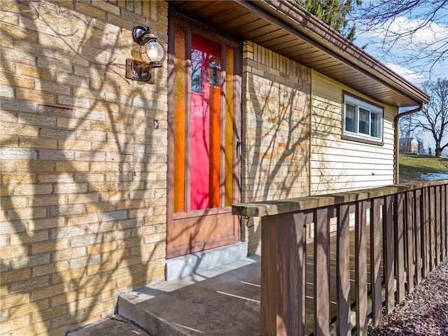 property entrance with brick siding