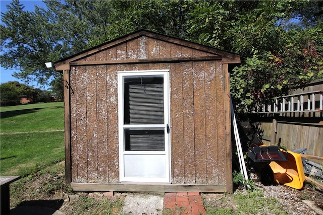 view of shed with fence