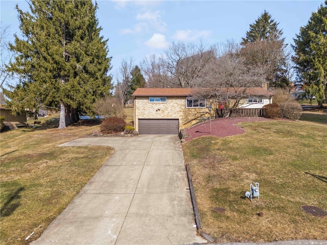 ranch-style home with a garage, stone siding, a front lawn, and driveway