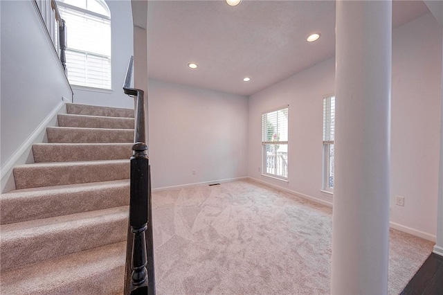 stairs featuring recessed lighting, carpet, visible vents, and baseboards