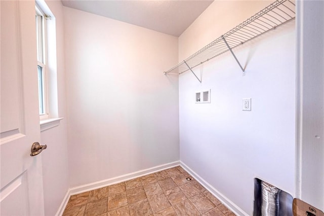 clothes washing area featuring washer hookup, laundry area, and baseboards