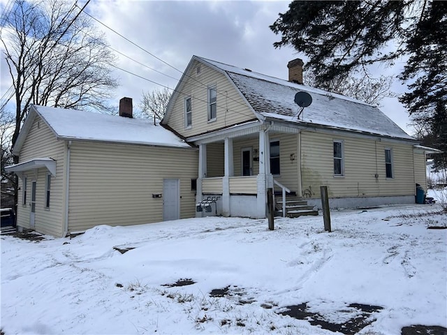 exterior space with a garage and a chimney