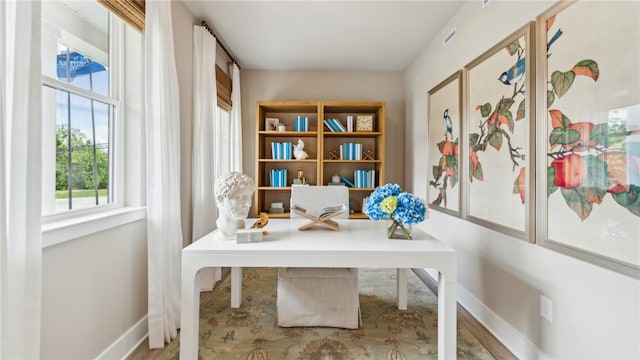 home office featuring visible vents and baseboards