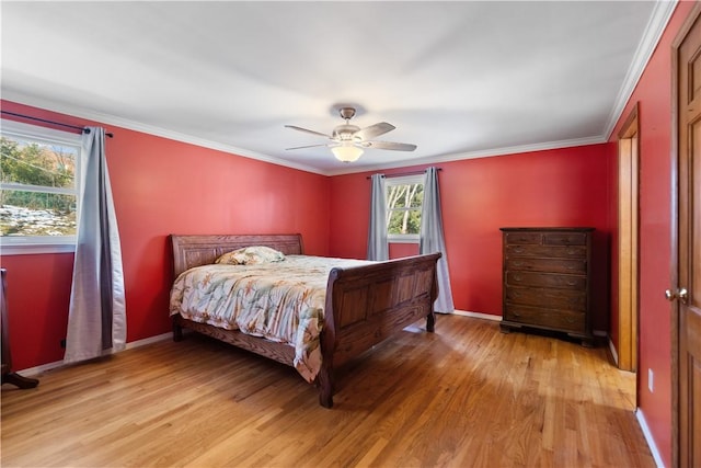 bedroom featuring light wood-style floors and crown molding