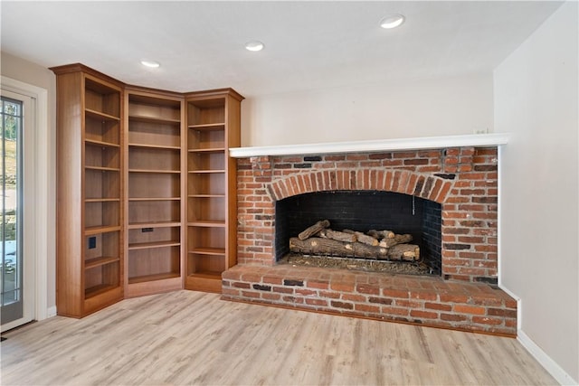 details with a fireplace, baseboards, wood finished floors, and recessed lighting