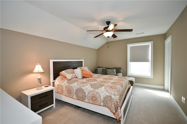 bedroom featuring lofted ceiling, ceiling fan, light colored carpet, visible vents, and baseboards