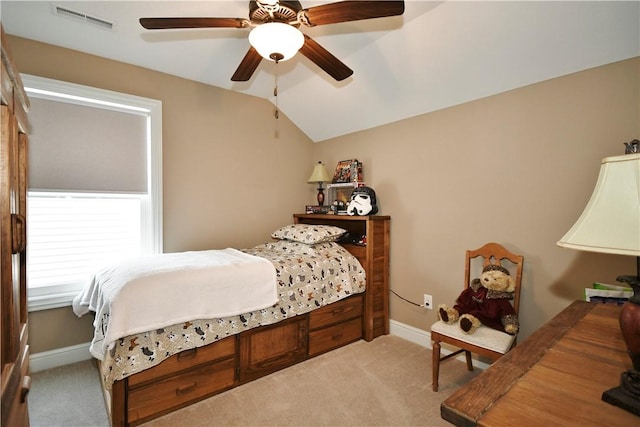 bedroom featuring visible vents, baseboards, ceiling fan, carpet, and vaulted ceiling