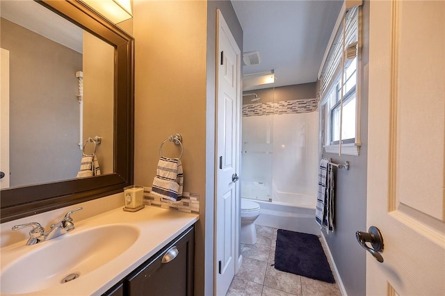 full bath with shower / bathtub combination, toilet, vanity, baseboards, and tile patterned floors