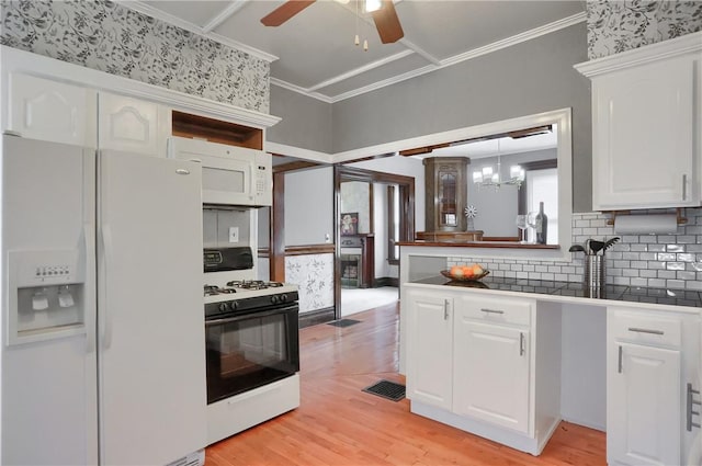 kitchen featuring white appliances, white cabinetry, light wood-type flooring, dark countertops, and crown molding