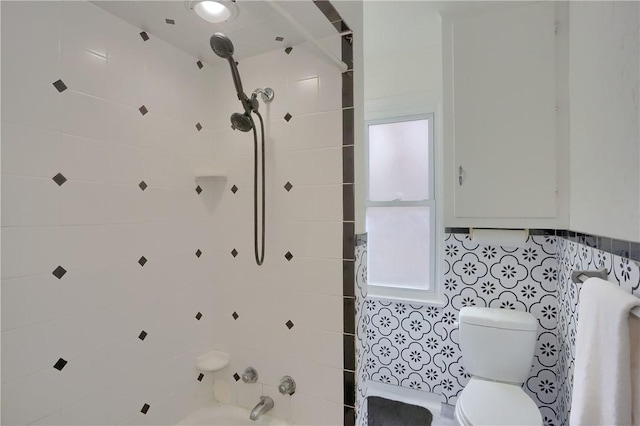 bathroom with toilet and shower / tub combination