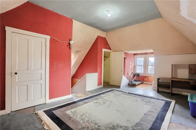 additional living space featuring vaulted ceiling