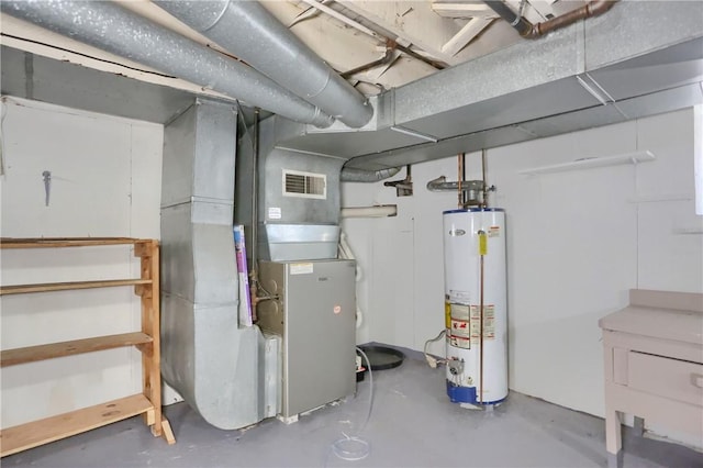 utilities with visible vents and gas water heater