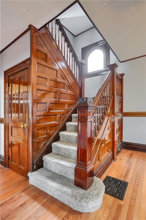 stairway with wood finished floors