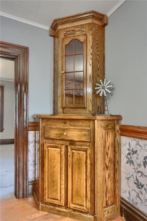 details with ornamental molding and wood finished floors