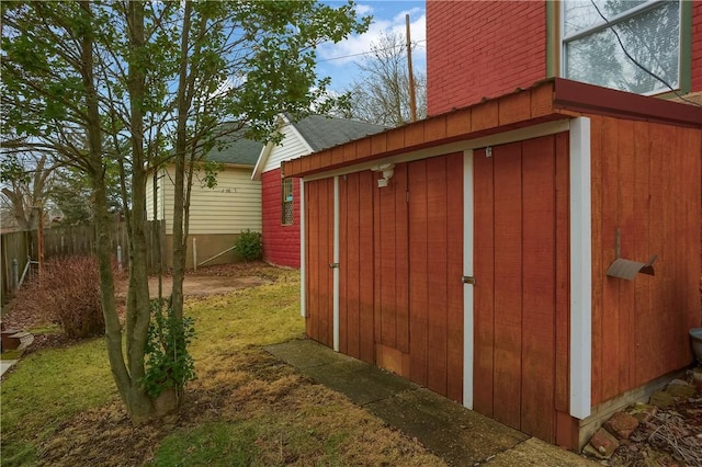 view of shed with fence