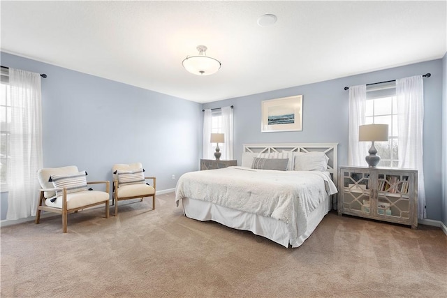 bedroom with carpet and baseboards