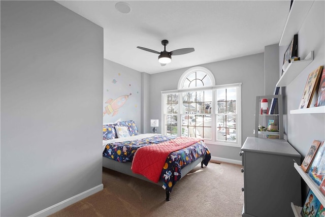 bedroom with a ceiling fan, light colored carpet, and baseboards