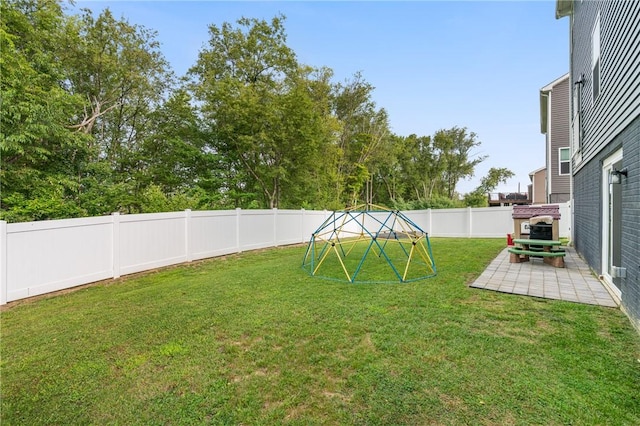 view of yard featuring a patio and a fenced backyard