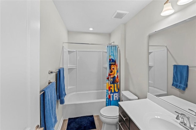 full bathroom with toilet, visible vents, shower / bath combo with shower curtain, and vanity